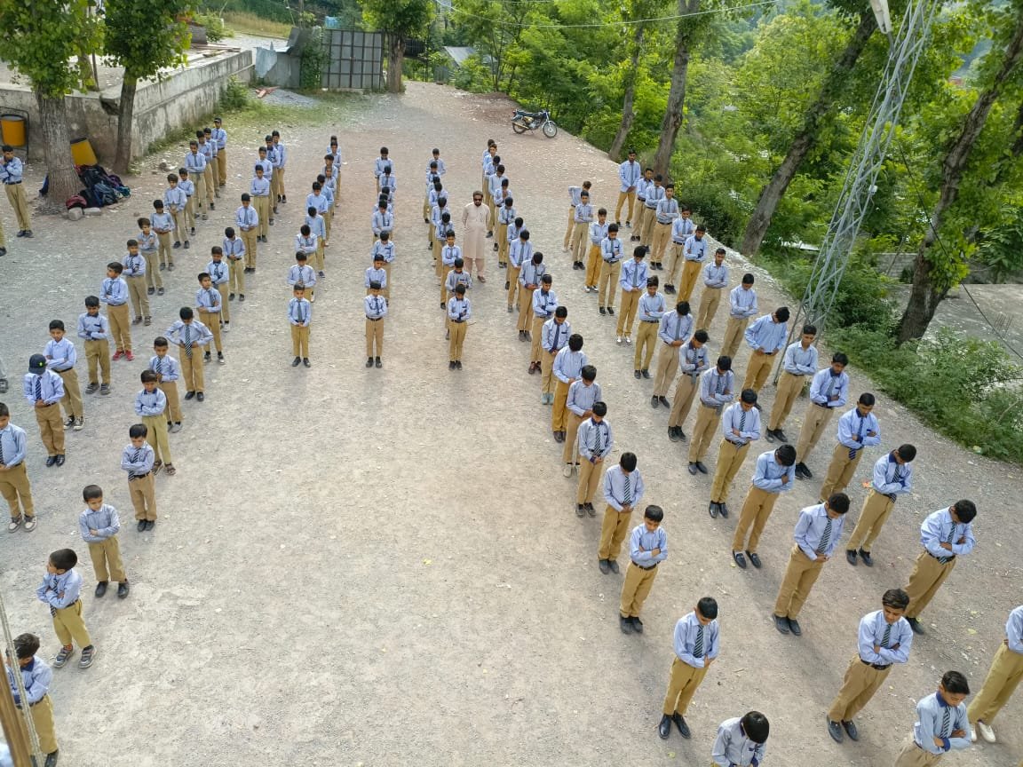 Students standing in lines during morning assembly